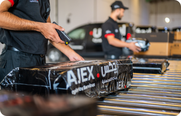 AJEX employee scanning the barcode of the shipments 