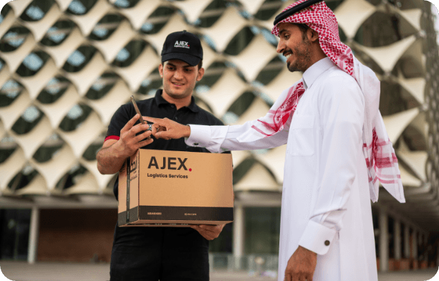 AJEX courier giving a box to a Saudi customer.